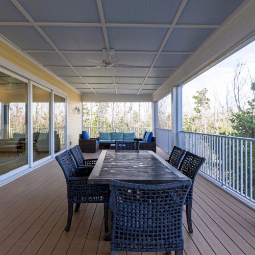Covered patio with dining table and outdoor seating