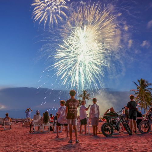 People watching fireworks at the beach