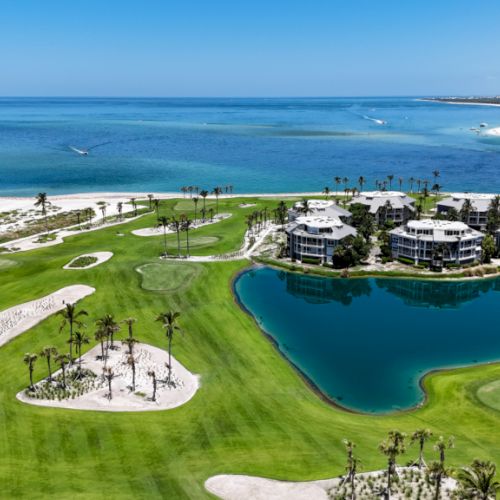 Aerial view of golf course by the ocean
