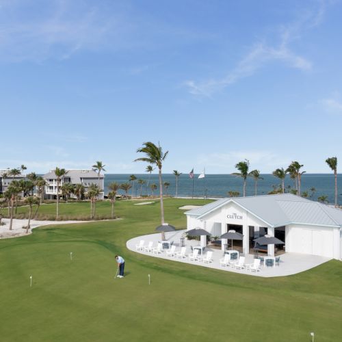 Golf clubhouse and putting green overlooking the ocean