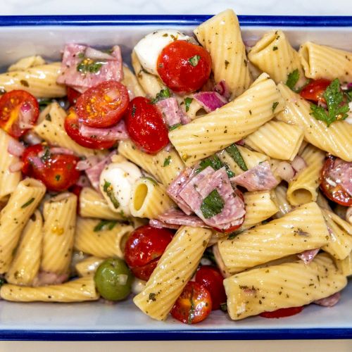 Italian pasta salad with tomatoes, mozzarella, and herbs