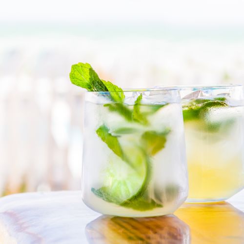 Refreshing cocktail with mint and lime by the beach
