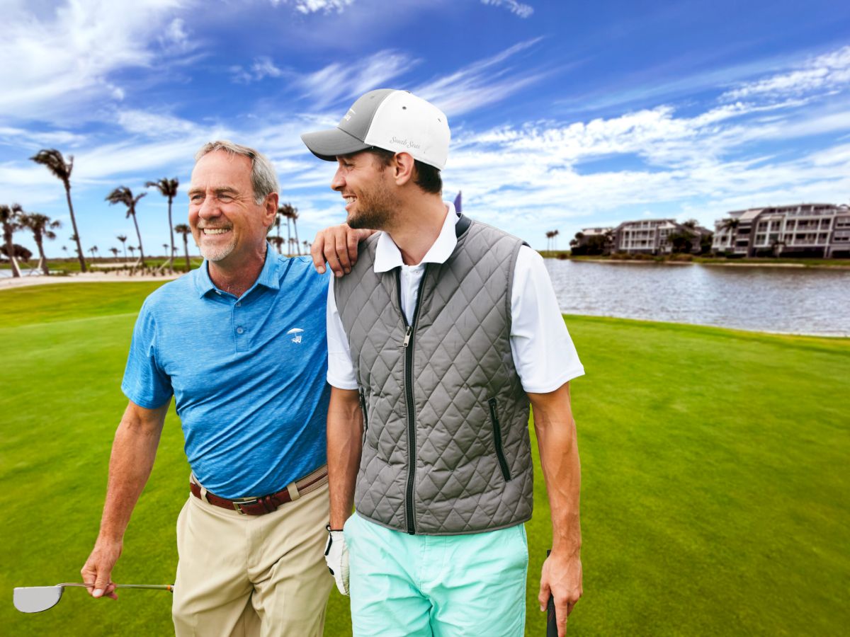 Two golfers smiling on the course