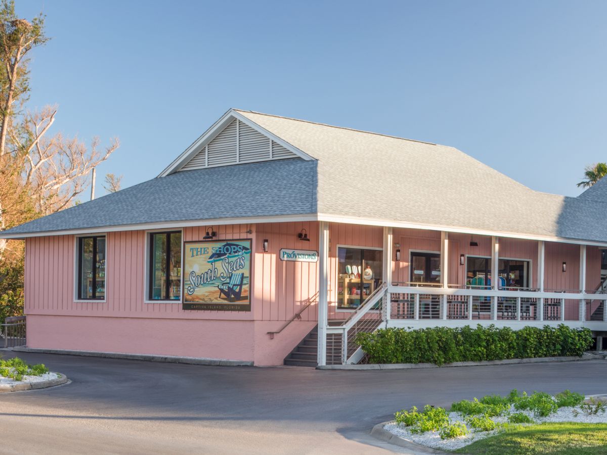 Coastal style market building with porch and signage