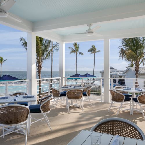 Outdoor dining area with ocean views at South Seas