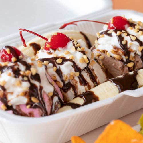shot of vanilla, chocolate and cherry gelato with chocolate sauce, cherry