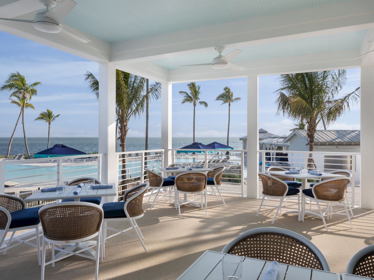 Outdoor dining area with ocean views at South Seas