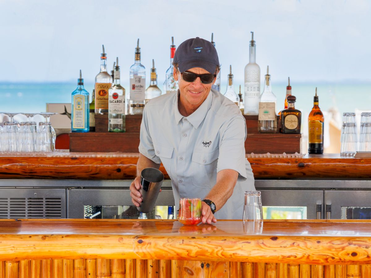 Bartender making drinks at a beach bar