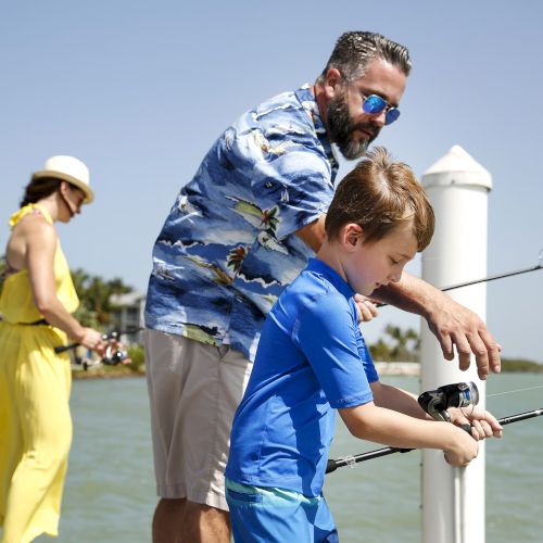 A father and son fishing.