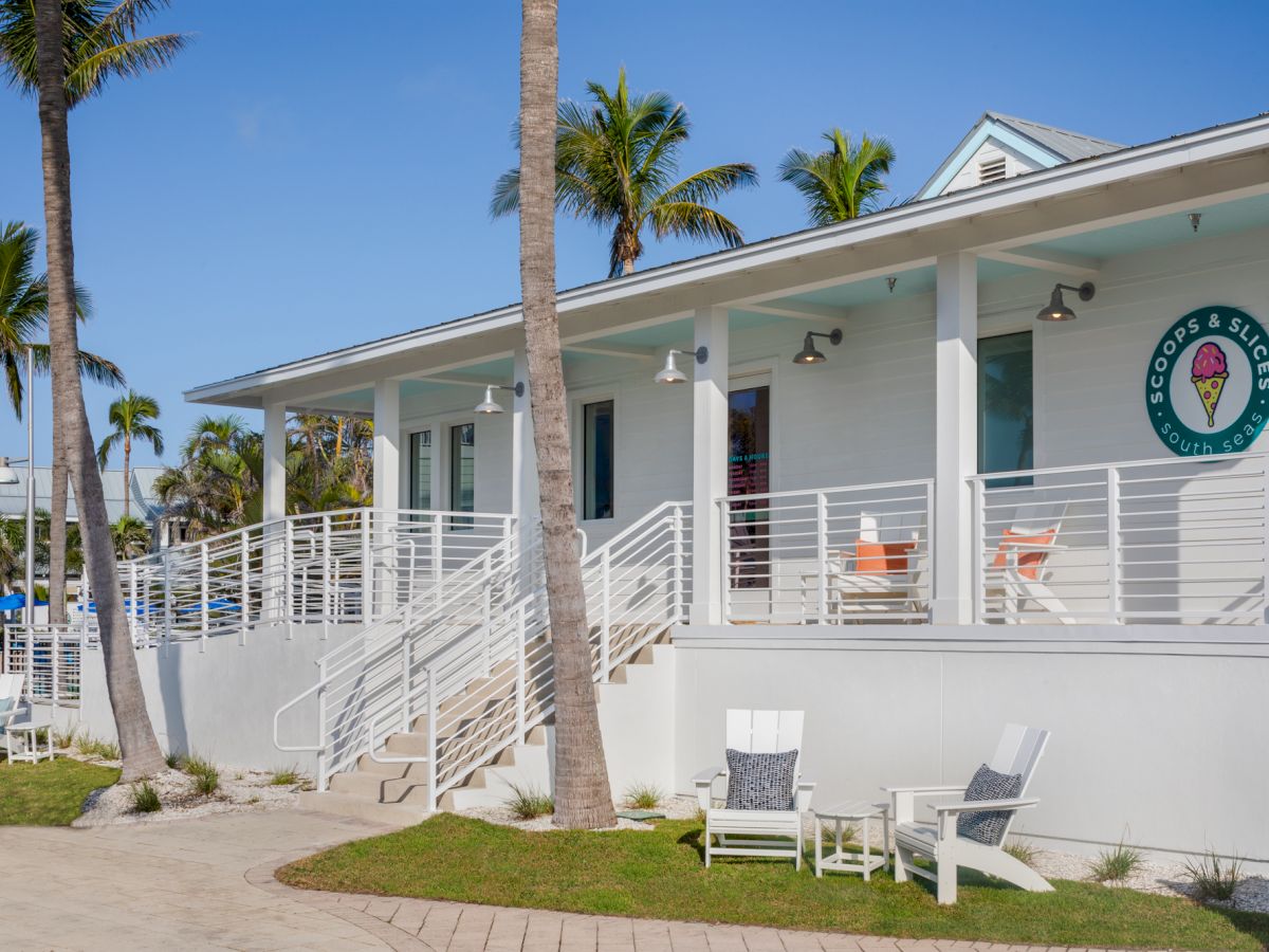Coastal style building with outdoor seating at South Seas
