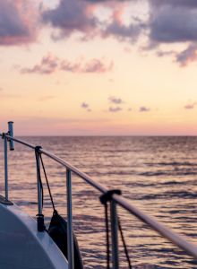 View from a boat deck at sunset