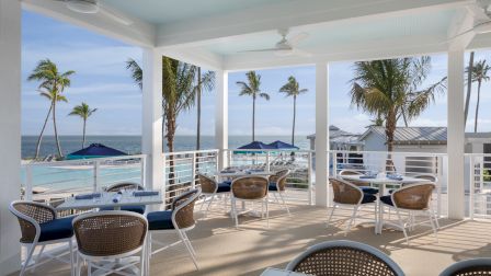 Outdoor dining area with ocean views at South Seas