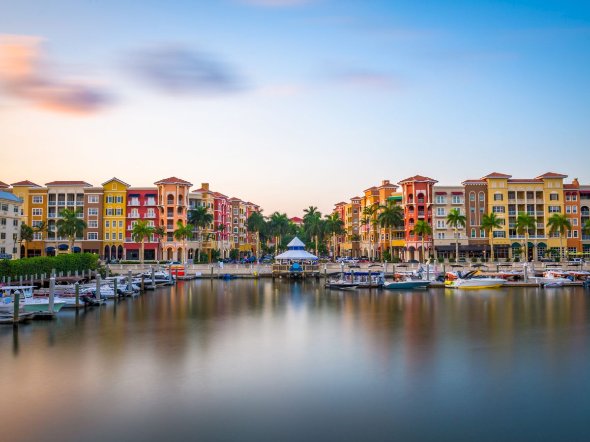 Naples, Florida, USA downtown cityscape on the bay at dusk.