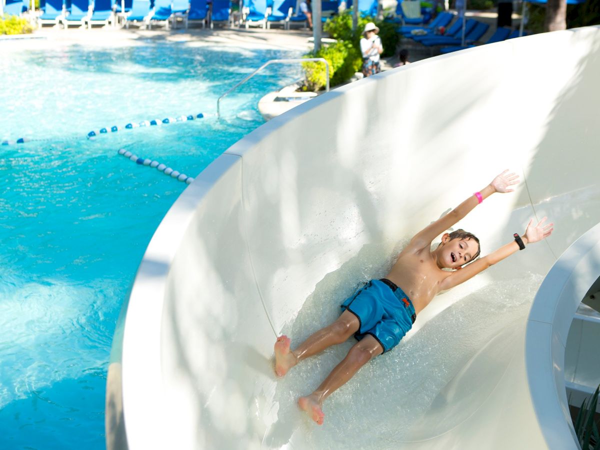 kid sliding down pool