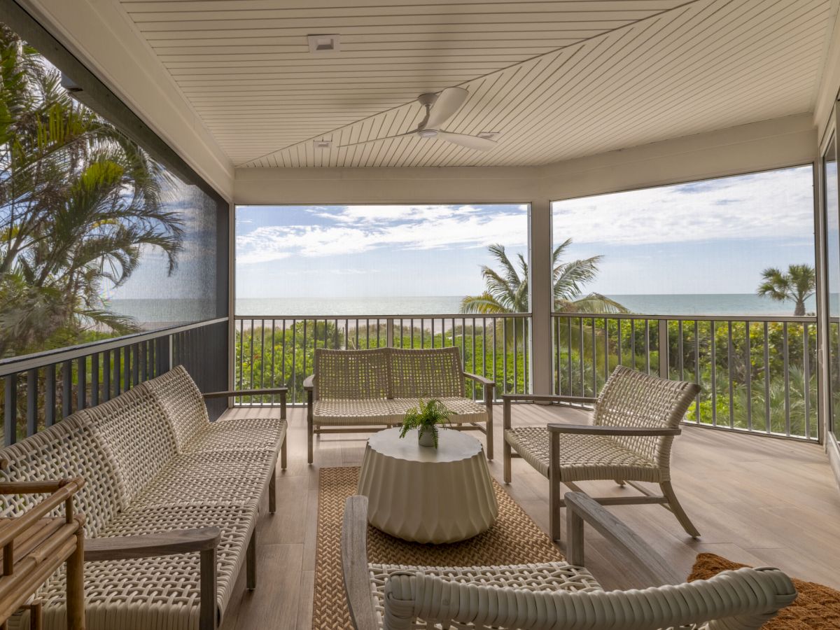 Outdoor patio with chairs and ocean view