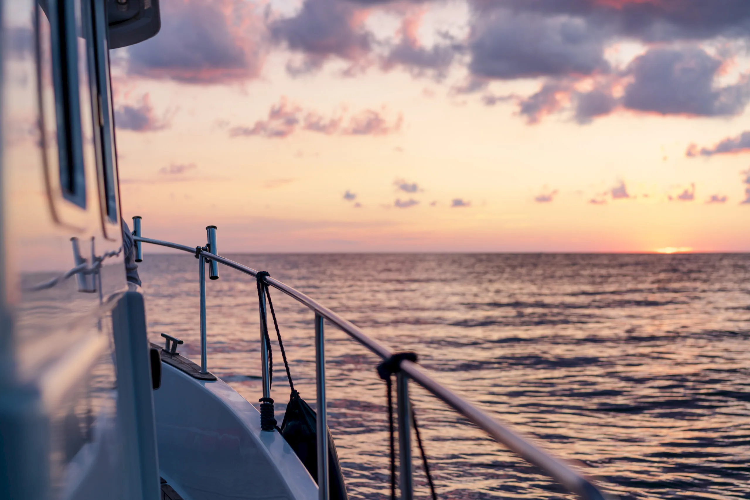 View from a boat deck at sunset