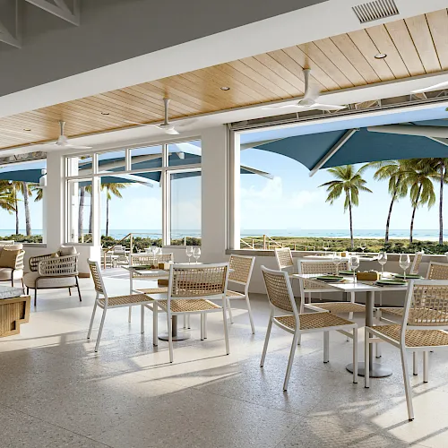 Coastal restaurant patio with tables and ocean views