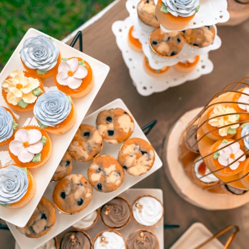 Tea party At The Garden, Beautiful English Afternoon Breakfast Ceremony with Desserts and Snacks, desserts various set, Placed in a cute white dish and the flower petals around. Relax and happy