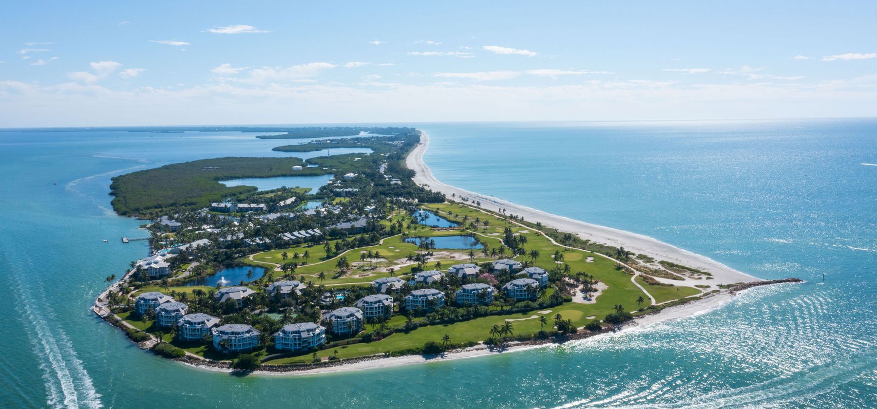Aerial view of a peaceful island surrounded by clear blue water