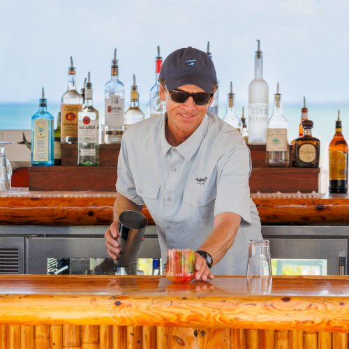 Bartender making drinks at a beach bar