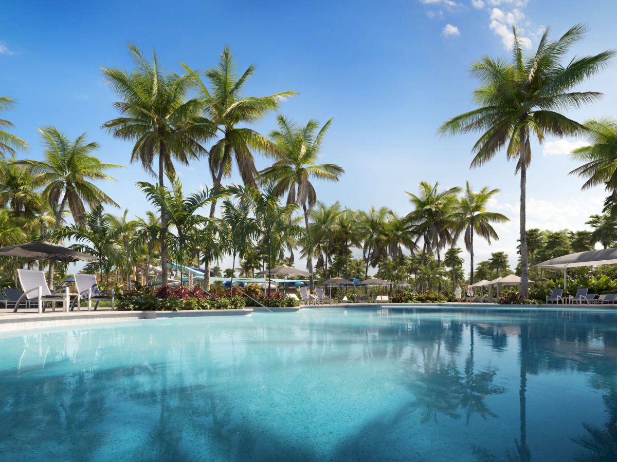 Palm trees reflecting in a resort pool at South Seas