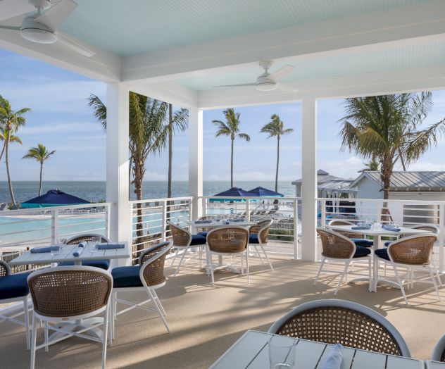 Outdoor dining area with ocean views at South Seas