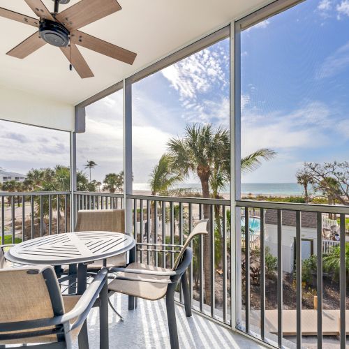 Outdoor table with four chairs and ceiling fan