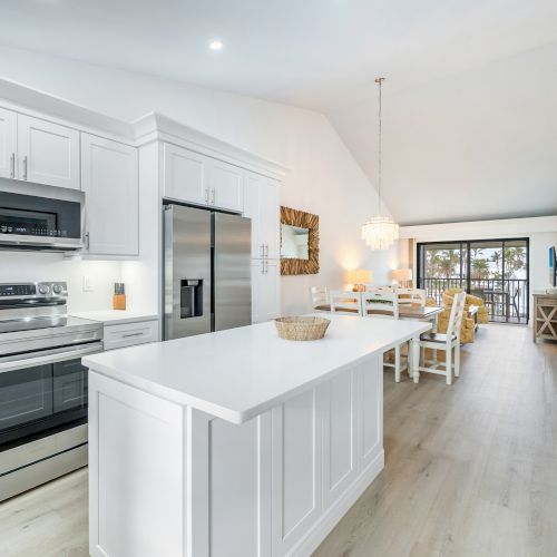 Bright kitchen with white cabinets and island