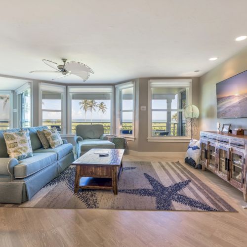 Living room with large windows and ocean view
