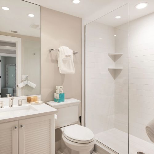 Bathroom with glass shower and white sink