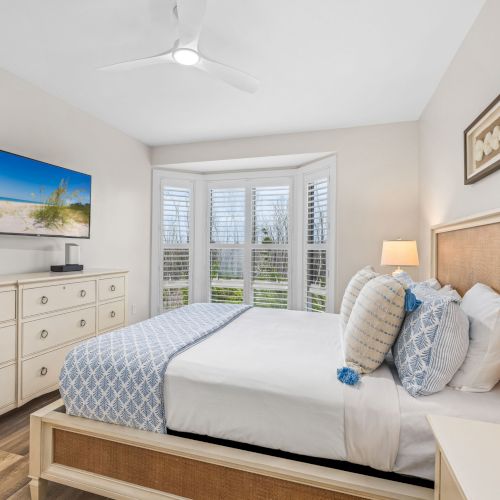 Bright bedroom with blue and white pillows
