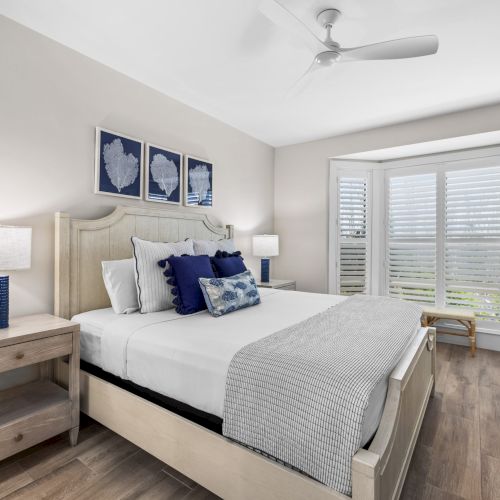 Bedroom with navy and white bedding