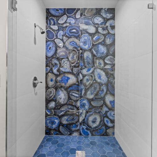 Shower with blue stone wall