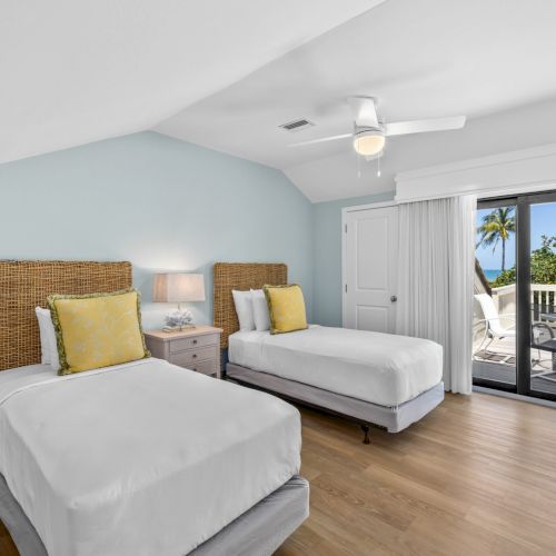 Bedroom with two twin beds and yellow pillows