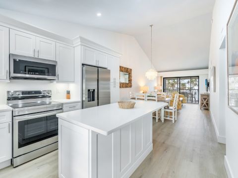 Bright kitchen with white cabinets and island