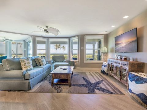 Living room with large windows and ocean view