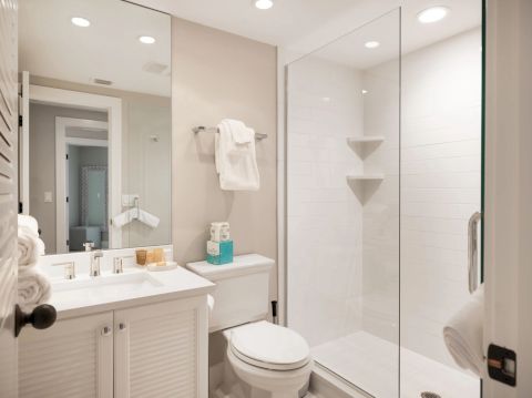 Bathroom with glass shower and white sink