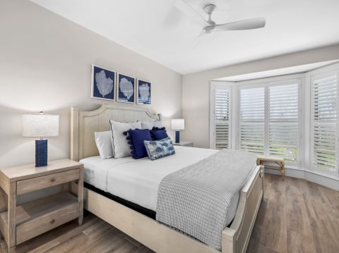 Bedroom with navy and white bedding