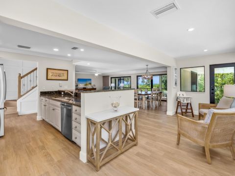 Kitchen and dining area with wood floors and natural light