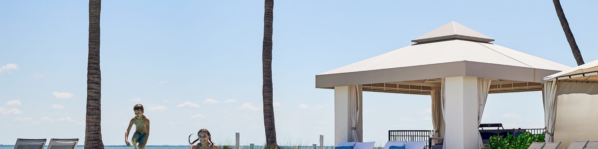 Children jumping into a pool at South Seas
